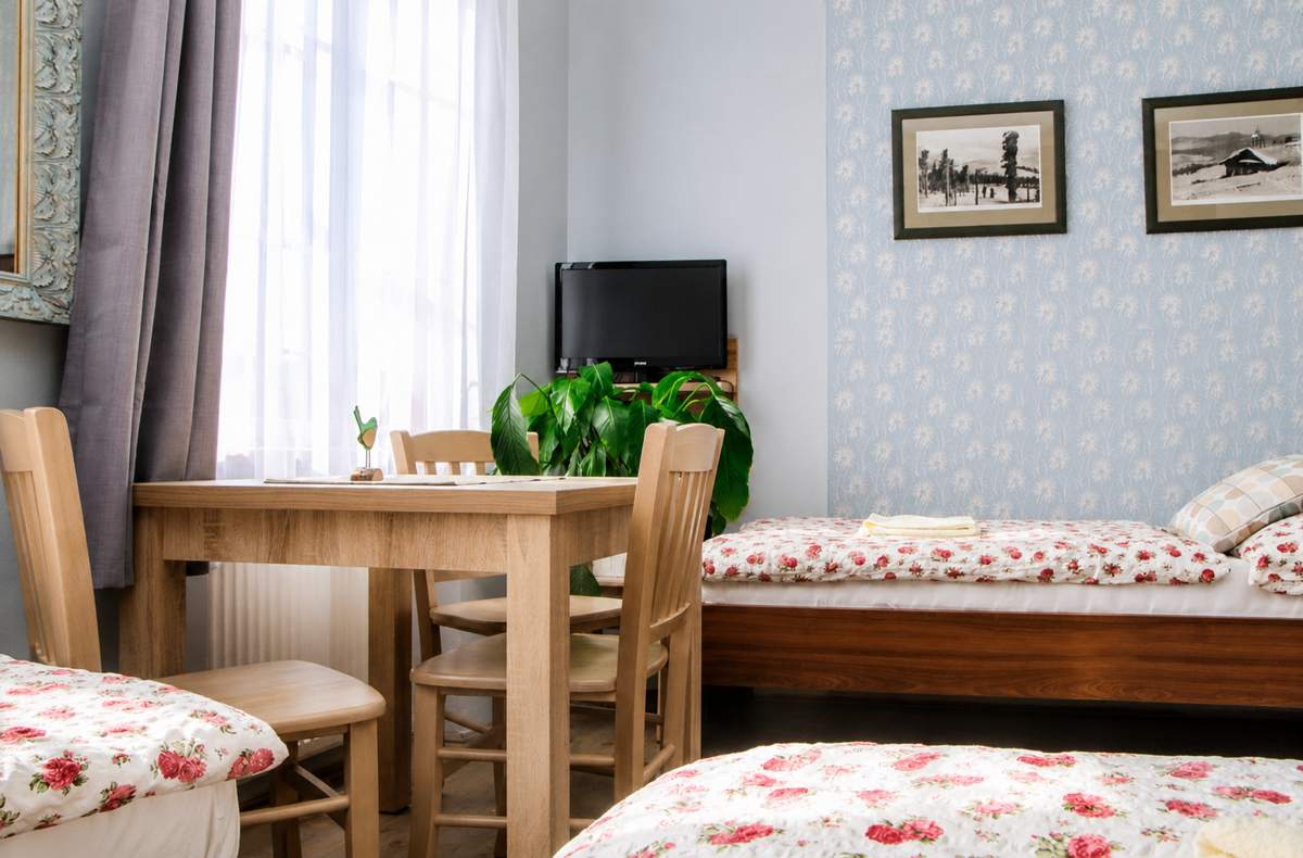 Comfortable guest room reflecting the personal old-town hospitality at Mini Hotel Abraka